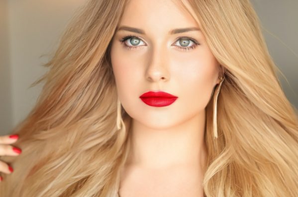 Beauty, makeup and hairstyle, face portrait of beautiful woman, red lipstick make-up and hair styling for skincare cosmetics, hair care, glamour style and fashion look idea