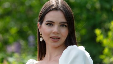 Portrait of a brunette girl outdoors in summer.