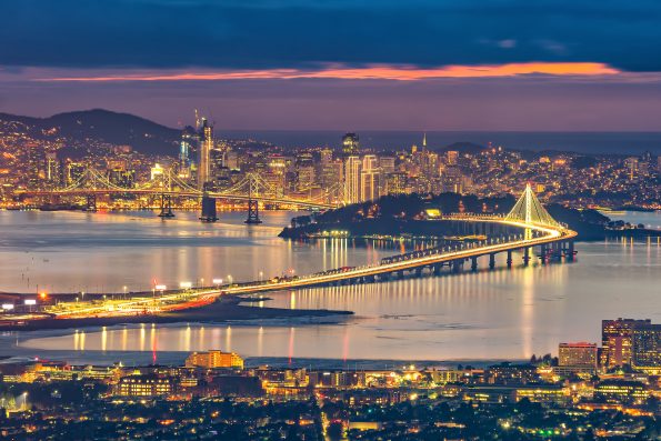 San Francisco skyline and Bay Bridge at sunset, California USA