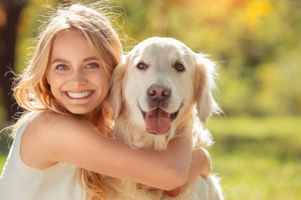 Young female blonde hair summer style concept with dog