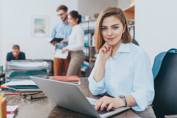 Young woman reading email at the office