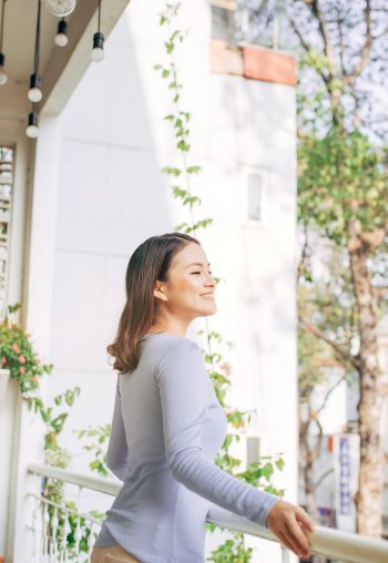 Woman enjoy her coffee at the balcony