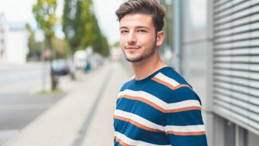 Portrait of young casual friendly man, selective focus, copy space