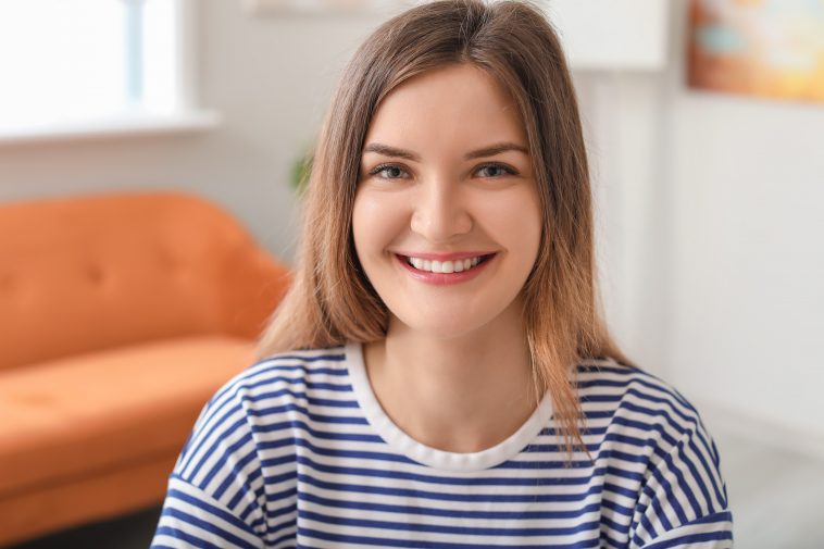 Beautiful young woman at home