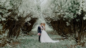 Wedding ceremony. Bride and groom alone in the shade of trees. A wedding in the summer.