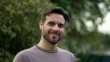 Confident 30s man portrait face smiling at camera. Tracking shot of a handsome male person from European origin closeup face 2