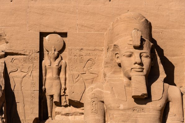 Abu Simbel, Egypt: Exterior view of the majestic statues of Ramses II that ornate the facade of the famous Abu Simbel temple in Upper Egypt.