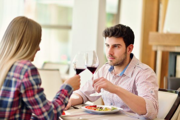 romantic lunch in a fancy restaurant.couple sitting and eating at lunch time.