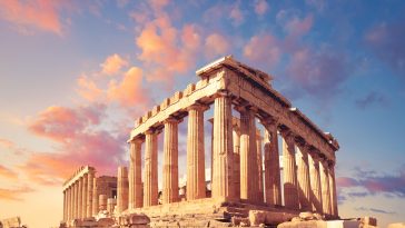 Parthenon temple on a sunset with pink and purple clouds. Acropolis in Athens, Greece