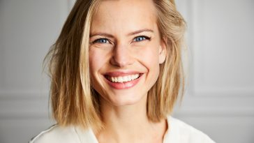 Beautiful smiling young woman with blue eyes, portrait