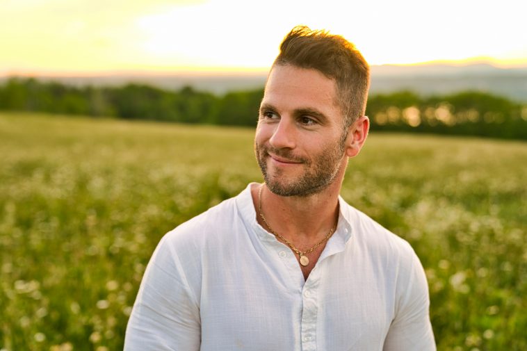 A Happy smiling mature man outdoor in a meadow