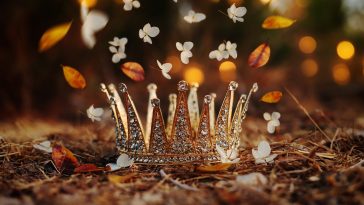 mysterious and magical photo of gold king crown in the England woods. Medieval period concept.