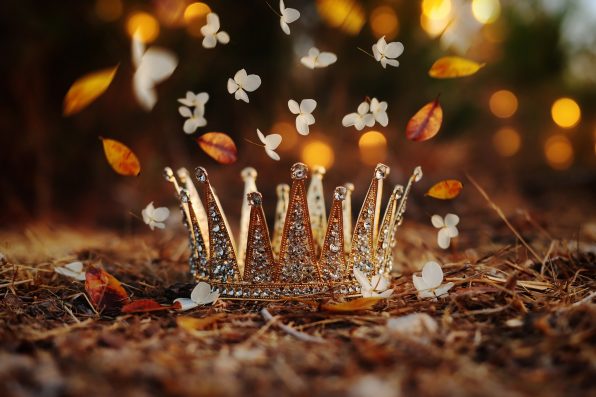 mysterious and magical photo of gold king crown in the England woods. Medieval period concept.