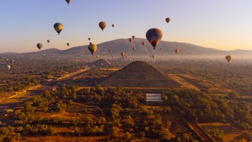 Sunrise on hot air balloon over the Teotihuacan pyramid