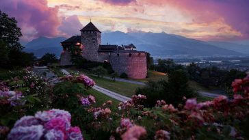 Vaduz Royal castle in Liechtenstein. Scenic landscape of old medieval castle in Alps mountains in summer. Beautiful view of Alpine nature.