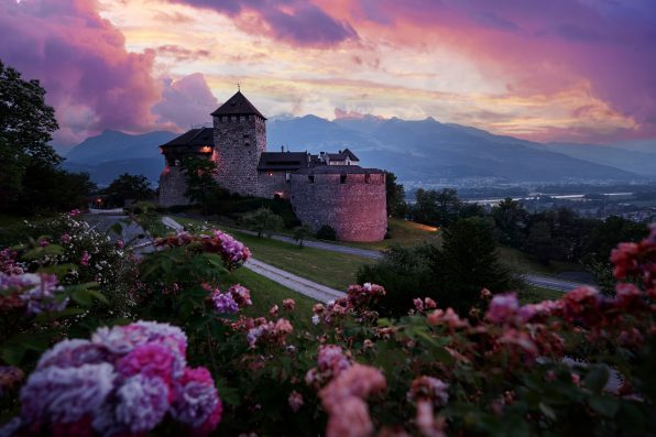 Vaduz Royal castle in Liechtenstein. Scenic landscape of old medieval castle in Alps mountains in summer. Beautiful view of Alpine nature.