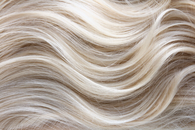 Female blonde curly hair texture