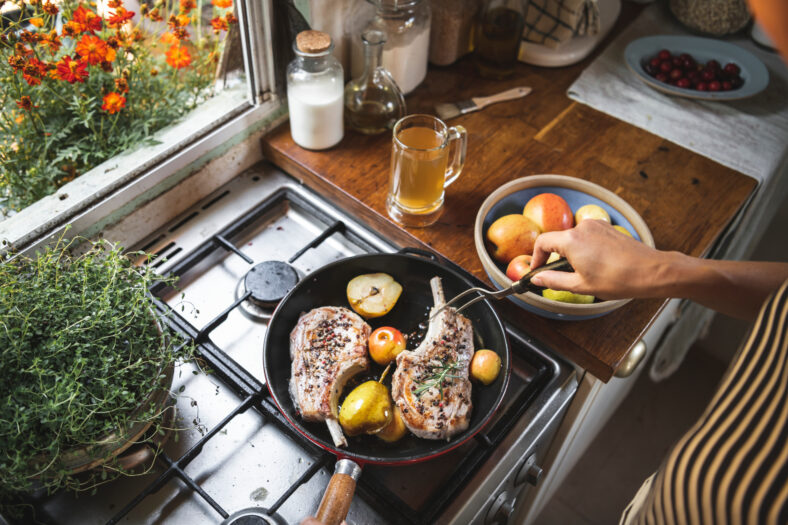 Chef cooking steak in a kitchen food photography recipe idea