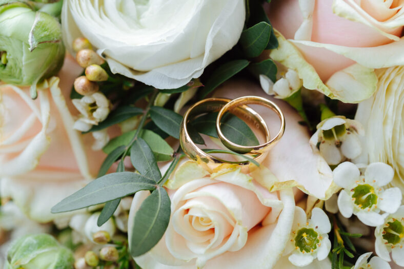 wedding rings on flowers