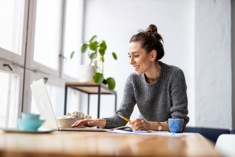 woman sitting at her desk doing work on the computer