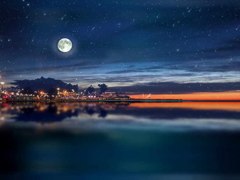 night sea water blurred city light,blue water wave  reflection  starry sky and moon in Italy  port harbor nature landscape