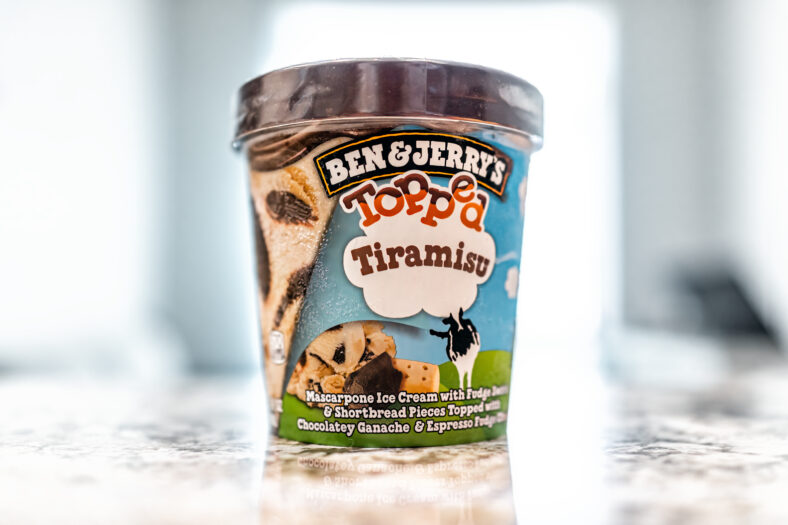 Avon, USA - June 23, 2022: Ben and Jerry's frozen ice cream with tiramisu flavor topped mascarpone cheese and fudge shortbread pieces with chocolate espresso ganache