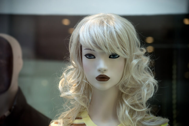 Closeup of blond hair  mannequin in a women fashion  store showroom