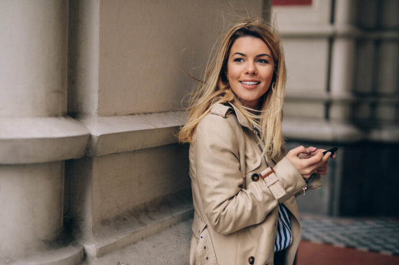 A young happy woman waiting for someone special to show up.