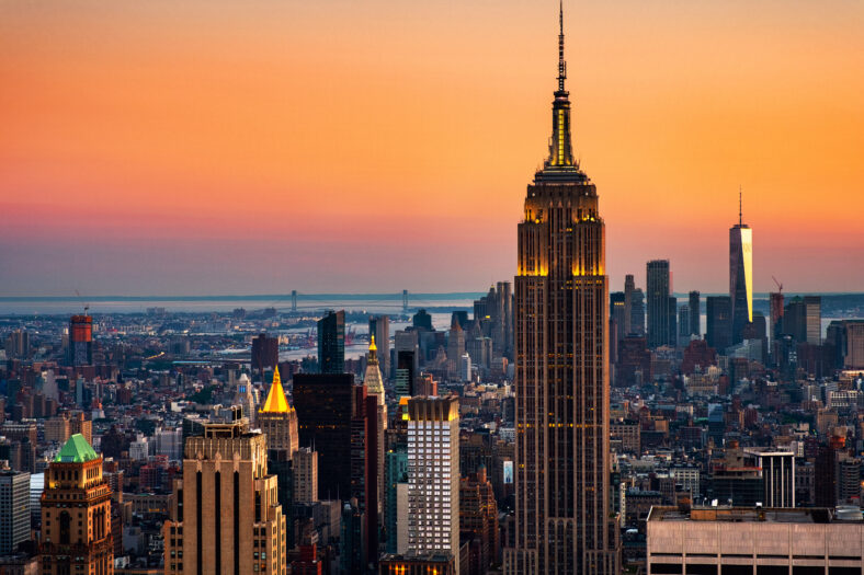 New York, USA. Aerial view on the city skyline in New York City, USA, on a warm sunny summer day with beautiful sky. Empire State Building, and the Upper Bay.