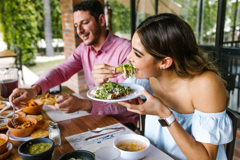 couple eating tacos at a restaurant