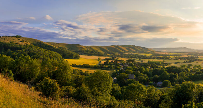 Beautiful views west over the village of Poynings from Devils Dyke to Chanctonbury ring on the south downs in west Sussex south east England UK