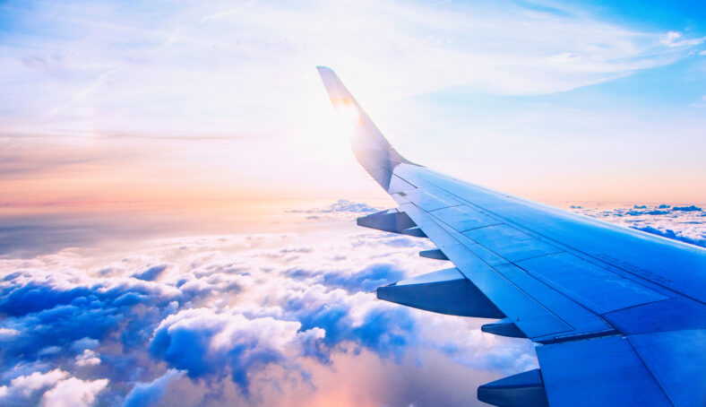 flying and traveling, view from airplane window on the wing