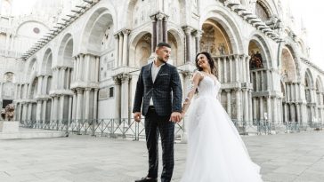 bride and groom on the background of a historic building,bride and groom walk the streets of the old city of venice,newlyweds dance,european wedding